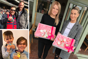 Friends and family holding cookie boxes